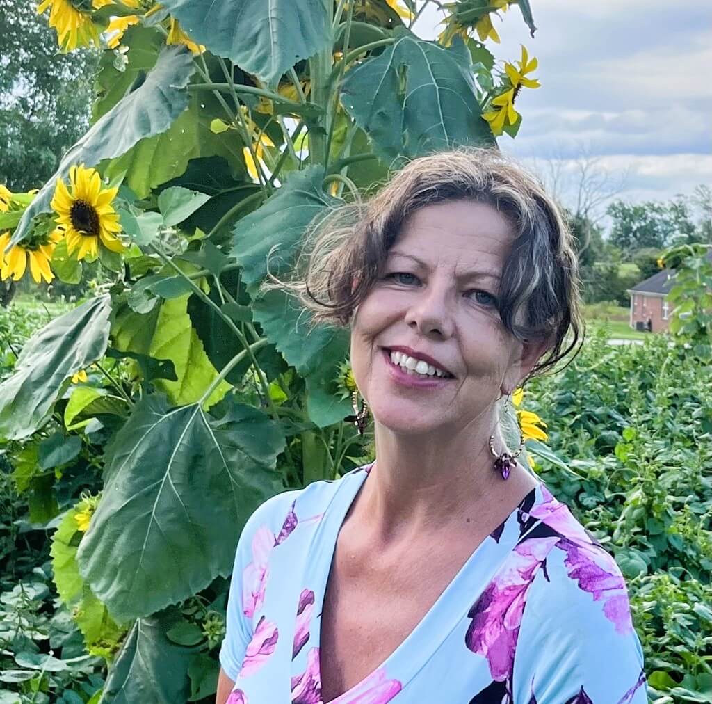 Sally Iseral with sunflowers